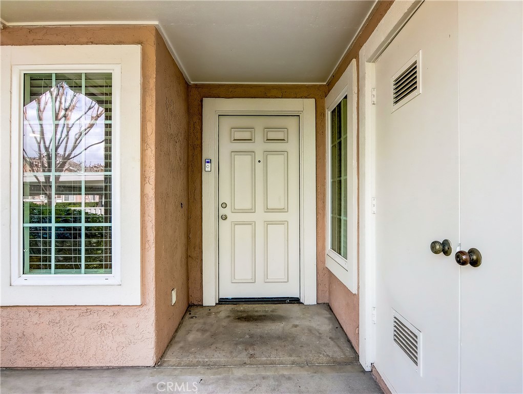 98 Greenfield, Unit 95 Irvine, CA 92614 - Photo 37 of 48 a view of a door with a door and wooden floor