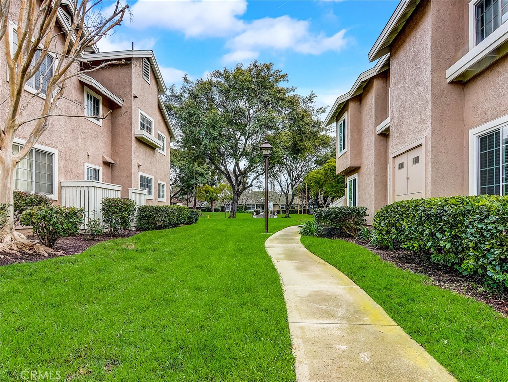 98 Greenfield, Unit 95 Irvine, CA 92614 - Photo 41 of 48 a front view of a house with a yard