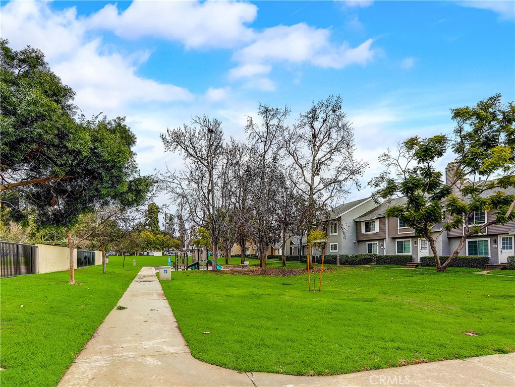 98 Greenfield, Unit 95 Irvine, CA 92614 - Photo 44 of 48 a view of house with a garden