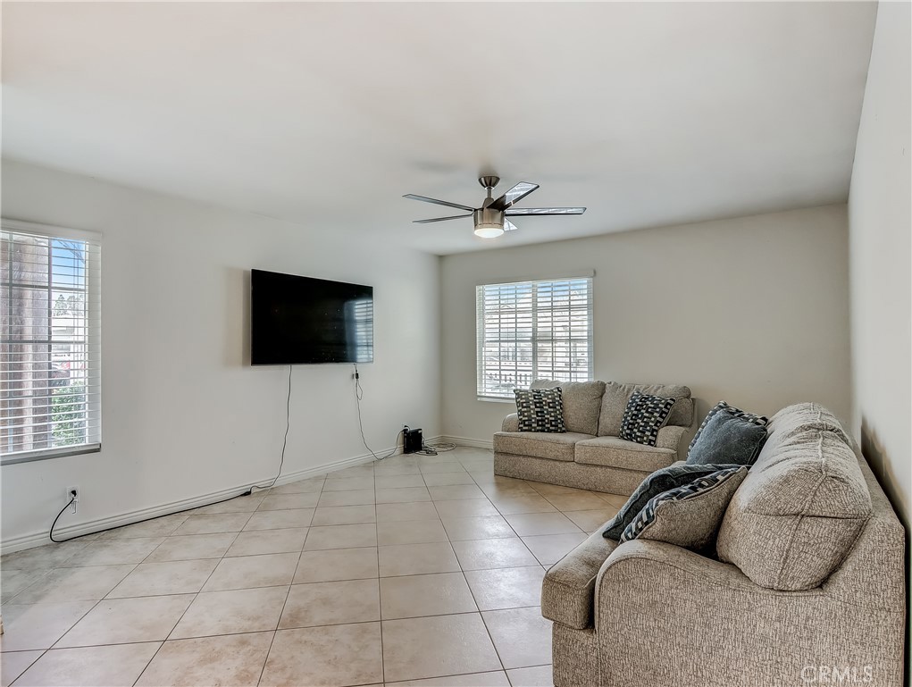 98 Greenfield, Unit 95 Irvine, CA 92614 - Photo 6 of 48 a living room with furniture and a flat screen tv