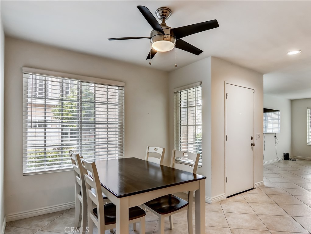 98 Greenfield, Unit 95 Irvine, CA 92614 - Photo 7 of 48 a dining room with furniture and window