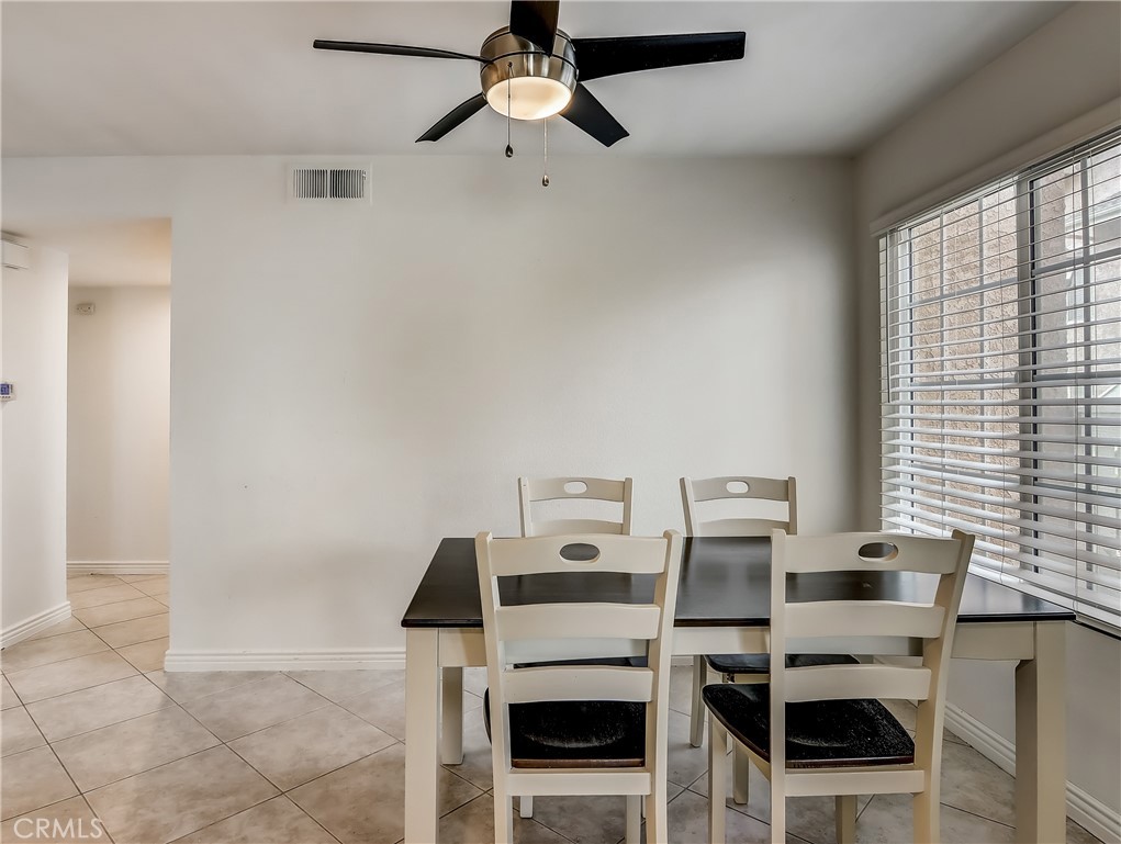 98 Greenfield, Unit 95 Irvine, CA 92614 - Photo 8 of 48 a dining room with furniture and window
