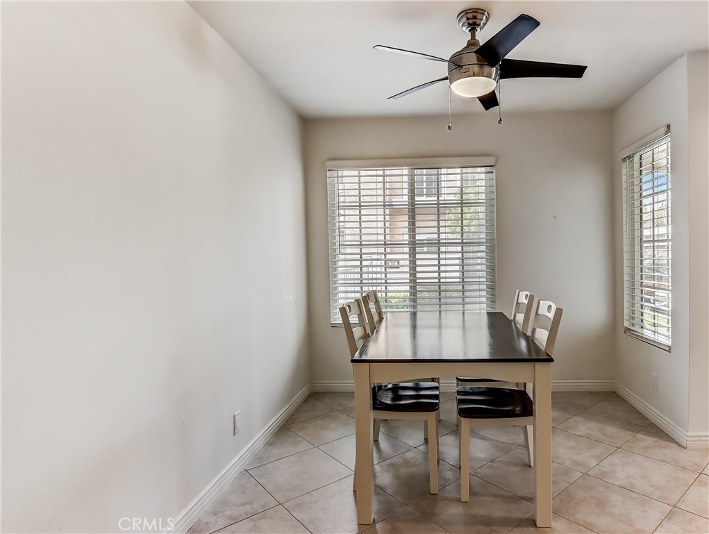 98 Greenfield, Unit 95 Irvine, CA 92614 - Photo 9 of 48 a dining room with furniture and window