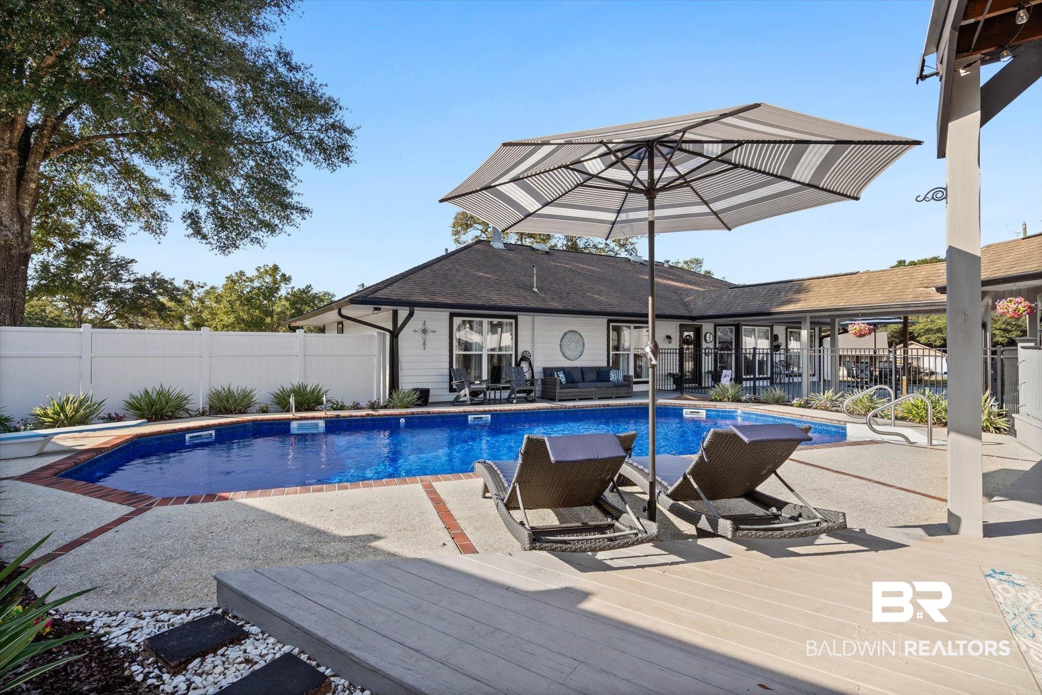 4567 Pine Avenue Saraland, AL 36571 - Photo 42 of 48 View of swimming pool featuring a patio and a wooden deck