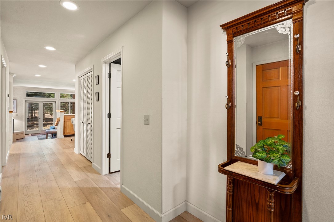 931 Incline Way, Unit 230 Incline Village, NV 89451 - Photo 14 of 24 a view of a hallway with wooden floor and a dining table