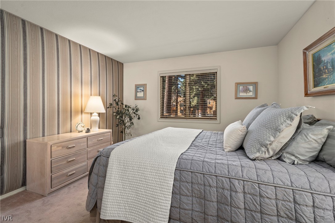 931 Incline Way, Unit 230 Incline Village, NV 89451 - Photo 15 of 24 a bedroom with a large bed and a window
