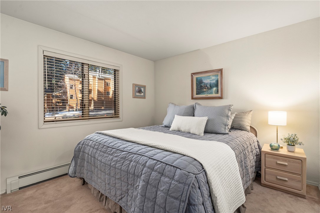 931 Incline Way, Unit 230 Incline Village, NV 89451 - Photo 16 of 24 a bedroom with a bed and a window