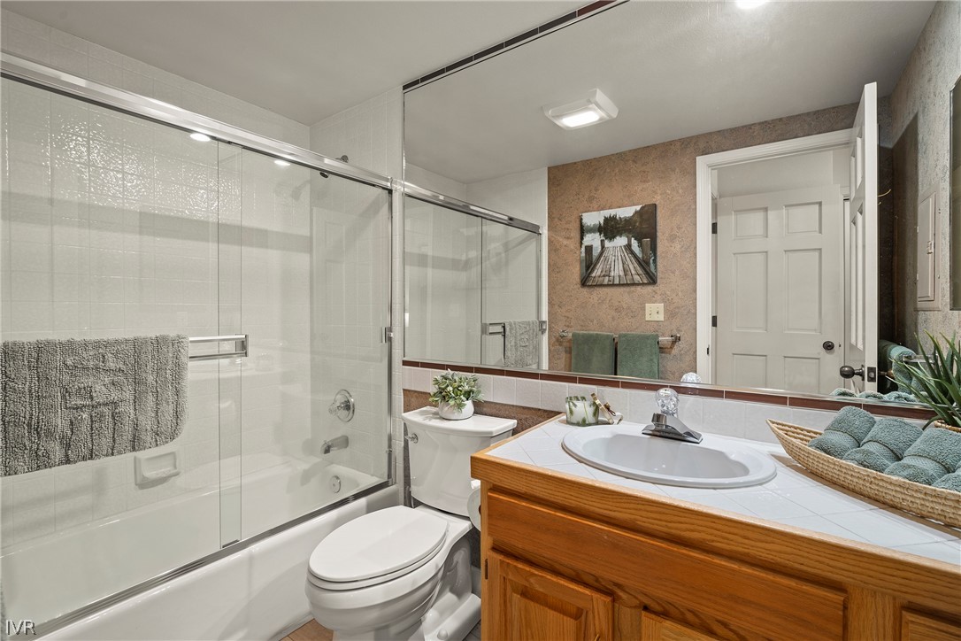 931 Incline Way, Unit 230 Incline Village, NV 89451 - Photo 17 of 24 a bathroom with a sink and a mirror