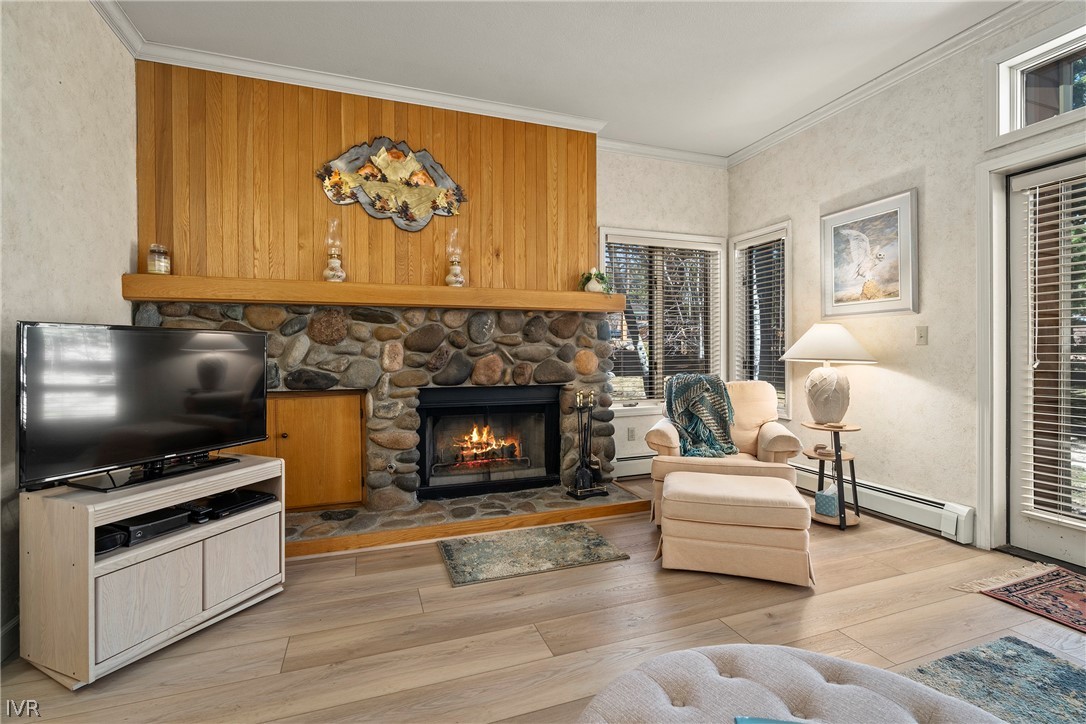 931 Incline Way, Unit 230 Incline Village, NV 89451 - Photo 5 of 24 a living room with furniture a flat screen tv and a fireplace