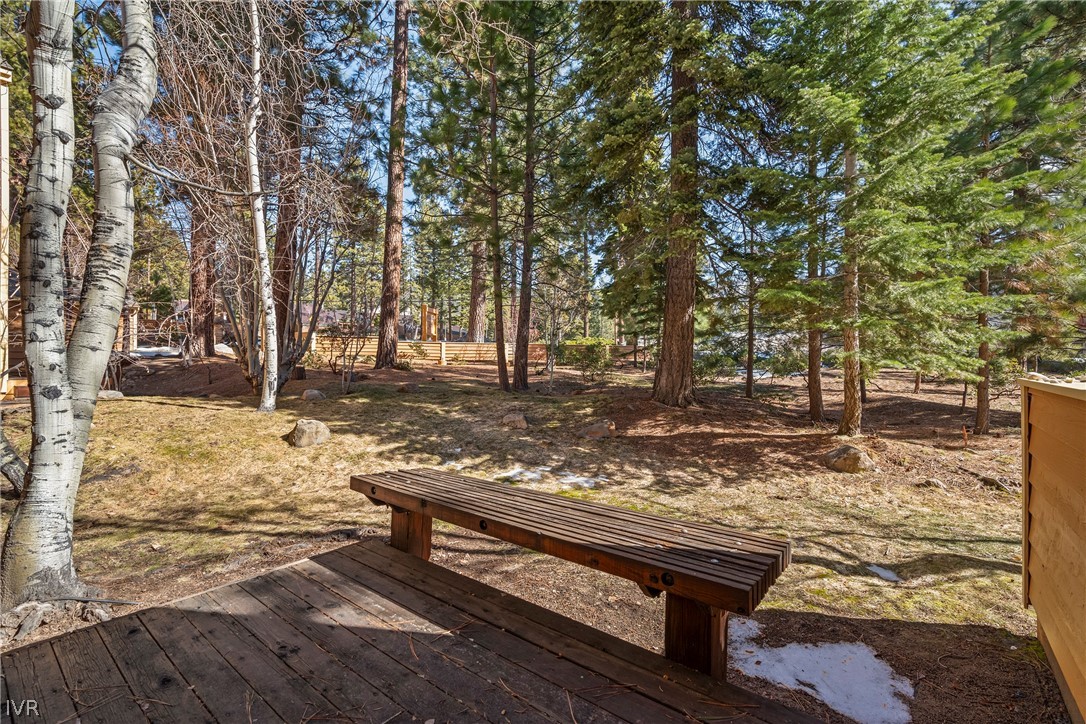 931 Incline Way, Unit 230 Incline Village, NV 89451 - Photo 6 of 24 a view of a yard with wooden fence and trees