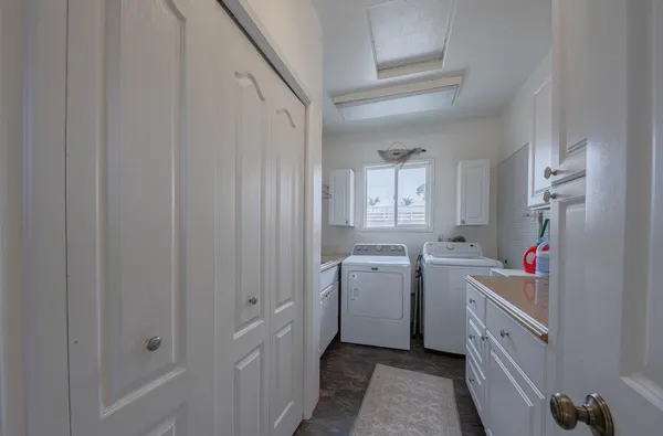 a utility room with dryer and washer