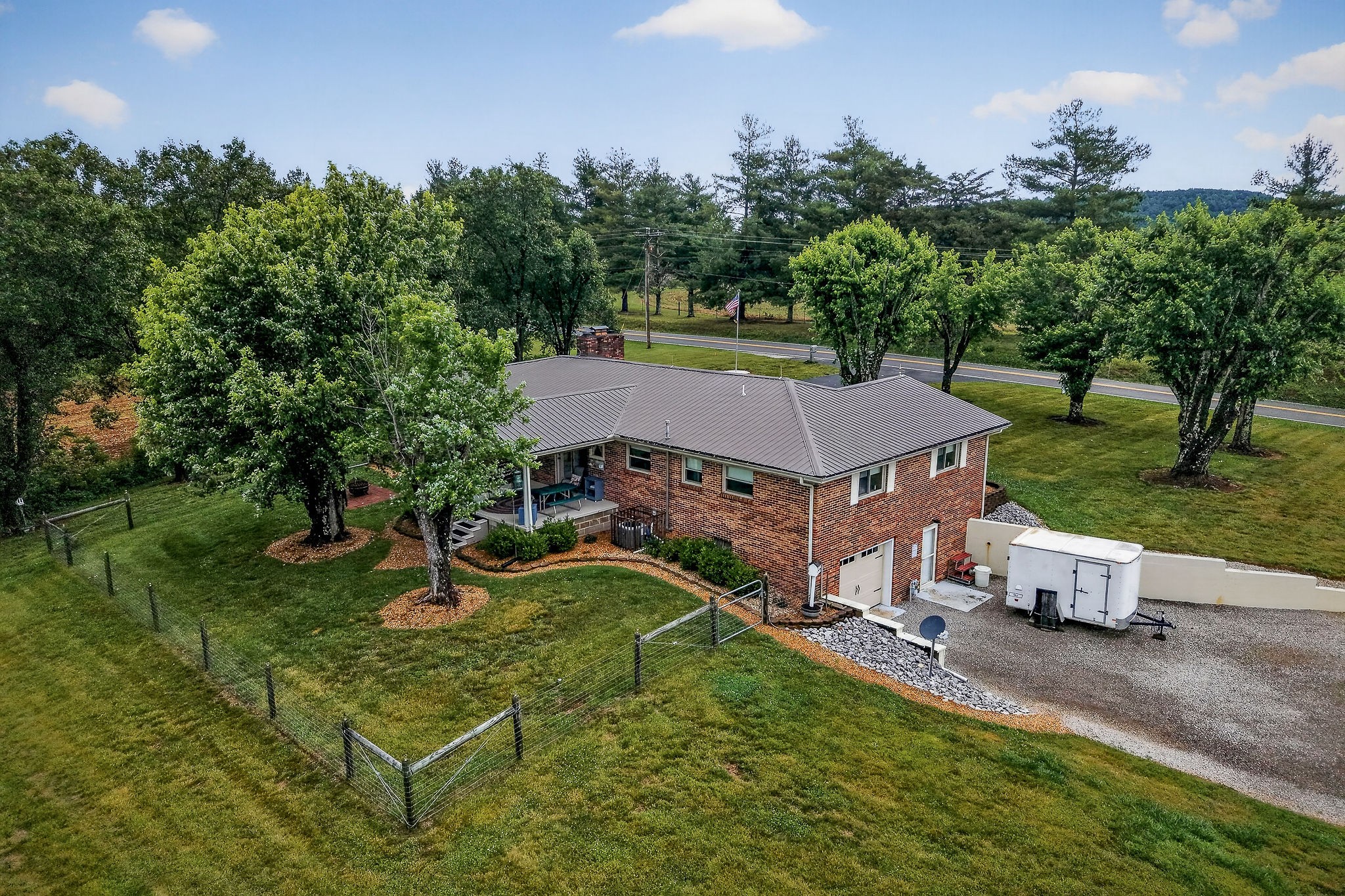1755 Burgess Falls Road Sparta, TN 38583 - Photo 5 of 56 an aerial view of a house with swimming pool garden and patio