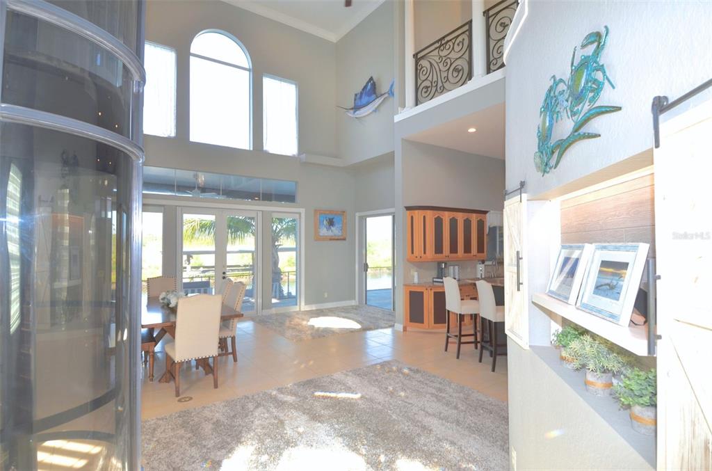 3605 Stabile Road St. James City, FL 33956 - Photo 20 of 95 a living room with furniture and a floor to ceiling window