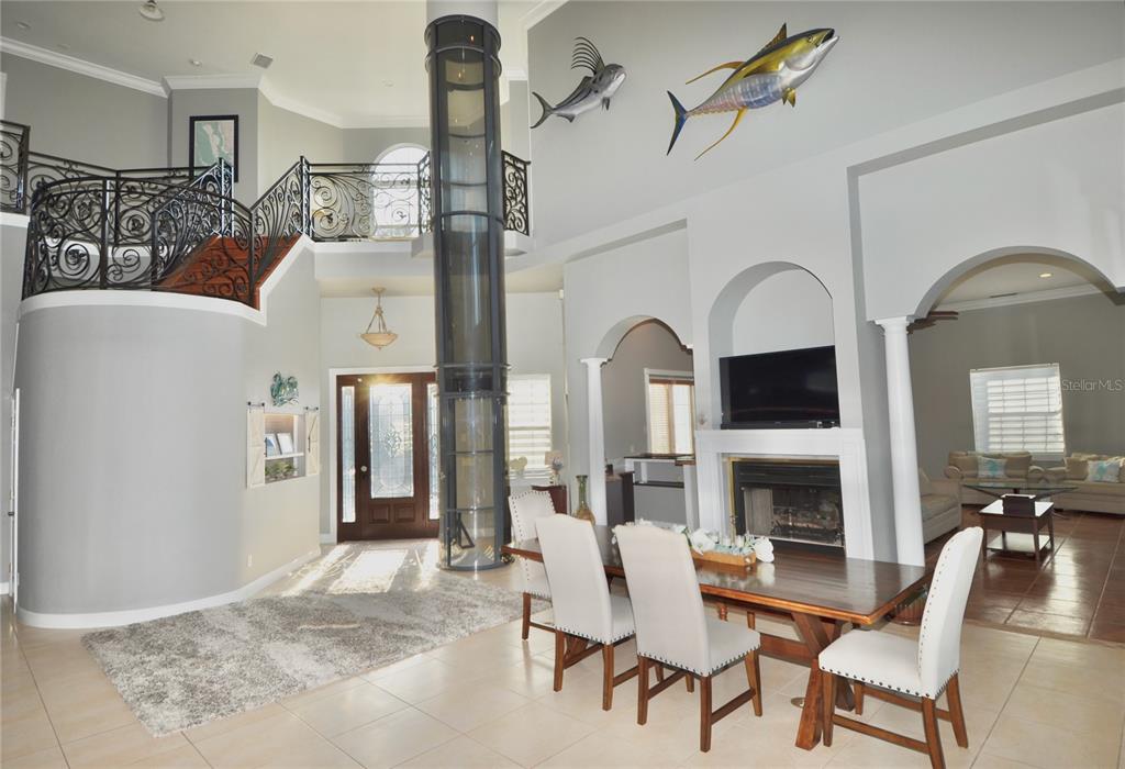 3605 Stabile Road St. James City, FL 33956 - Photo 22 of 95 a living room with furniture a fireplace and a flat screen tv