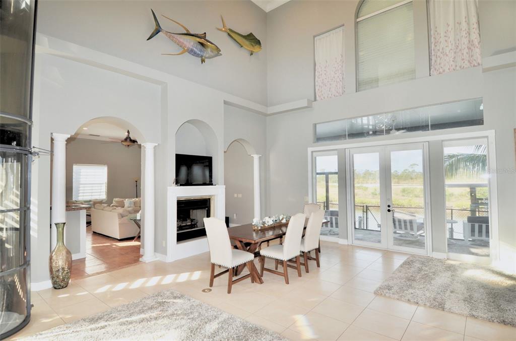 3605 Stabile Road St. James City, FL 33956 - Photo 25 of 95 a living room with furniture a fireplace and a flat screen tv