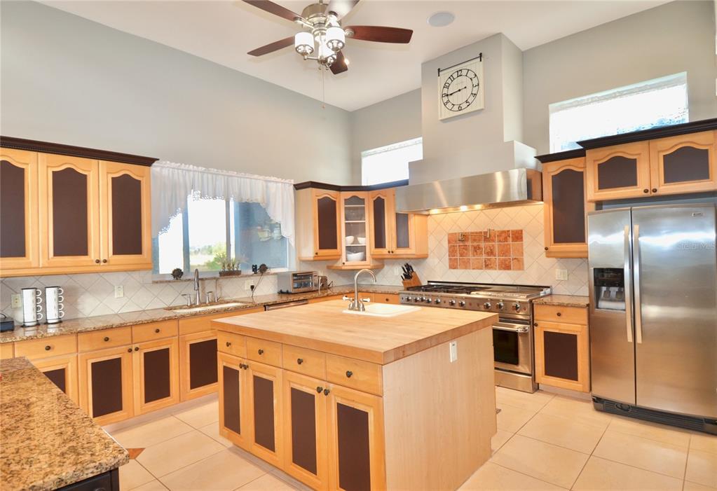 3605 Stabile Road St. James City, FL 33956 - Photo 31 of 95 a kitchen that has a lot of cabinets in it and kitchen