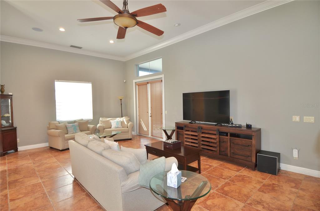 3605 Stabile Road St. James City, FL 33956 - Photo 35 of 95 a living room with furniture and a flat screen tv