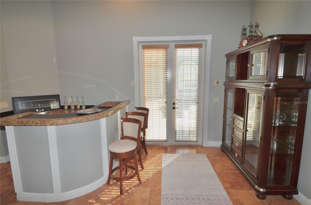3605 Stabile Road St. James City, FL 33956 - Photo 38 of 95 a view of a kitchen area with furniture and staircase