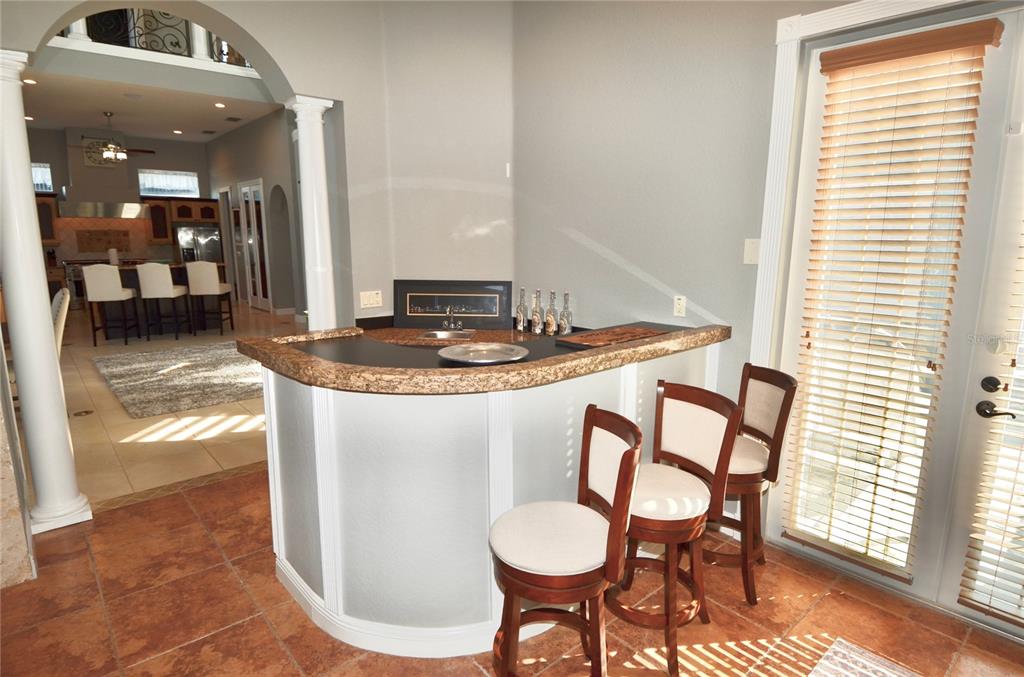 3605 Stabile Road St. James City, FL 33956 - Photo 39 of 95 a dining room with furniture and a floor to ceiling window