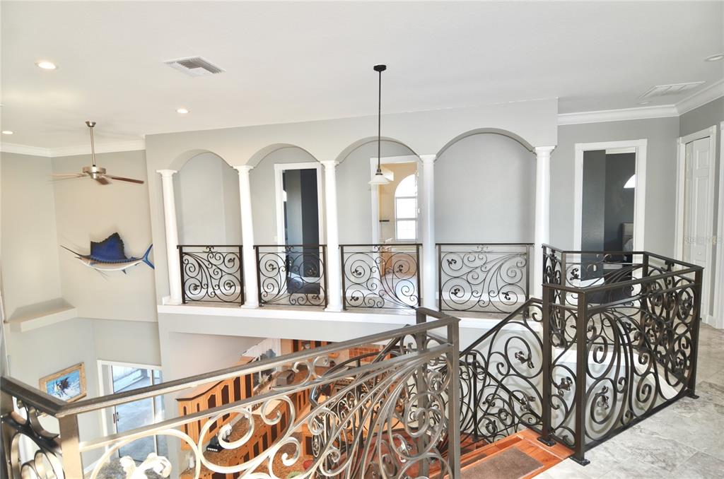 3605 Stabile Road St. James City, FL 33956 - Photo 44 of 95 a view of a hallway with wooden floor and windows