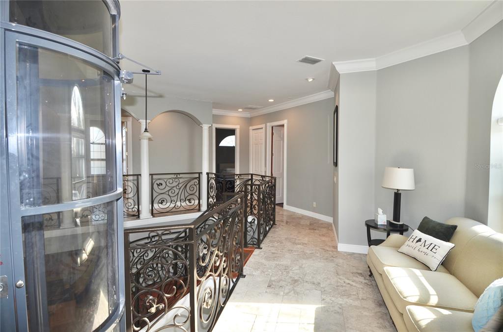 3605 Stabile Road St. James City, FL 33956 - Photo 45 of 95 a living room with furniture a window and a glass door