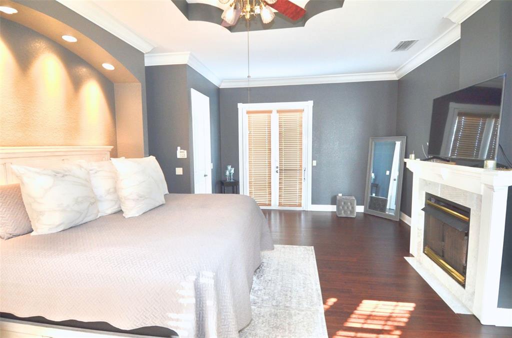 3605 Stabile Road St. James City, FL 33956 - Photo 50 of 95 a bedroom with a bed and a fireplace