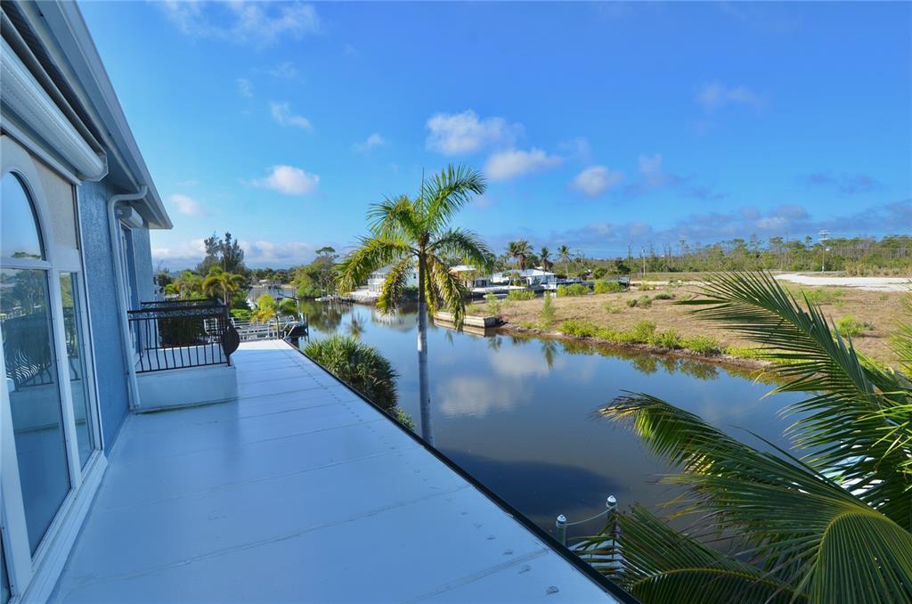 3605 Stabile Road St. James City, FL 33956 - Photo 57 of 95 a view of a lake from a balcony