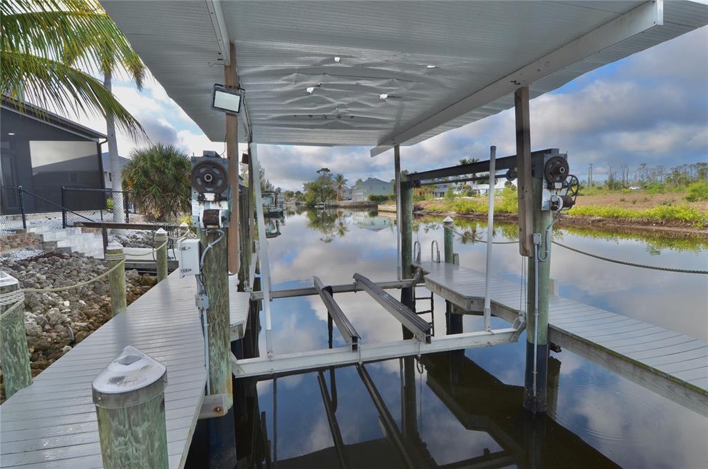 3605 Stabile Road St. James City, FL 33956 - Photo 77 of 95 a view of a swimming pool with a patio and dining table
