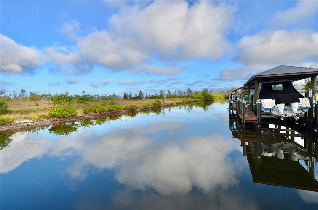 3605 Stabile Road St. James City, FL 33956 - Photo 79 of 95 a view of a lake with a mountain in the back