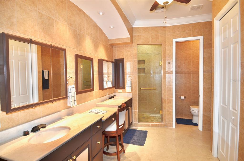 3605 Stabile Road St. James City, FL 33956 - Photo 8 of 95 a bathroom with a tub sink shower and a mirror