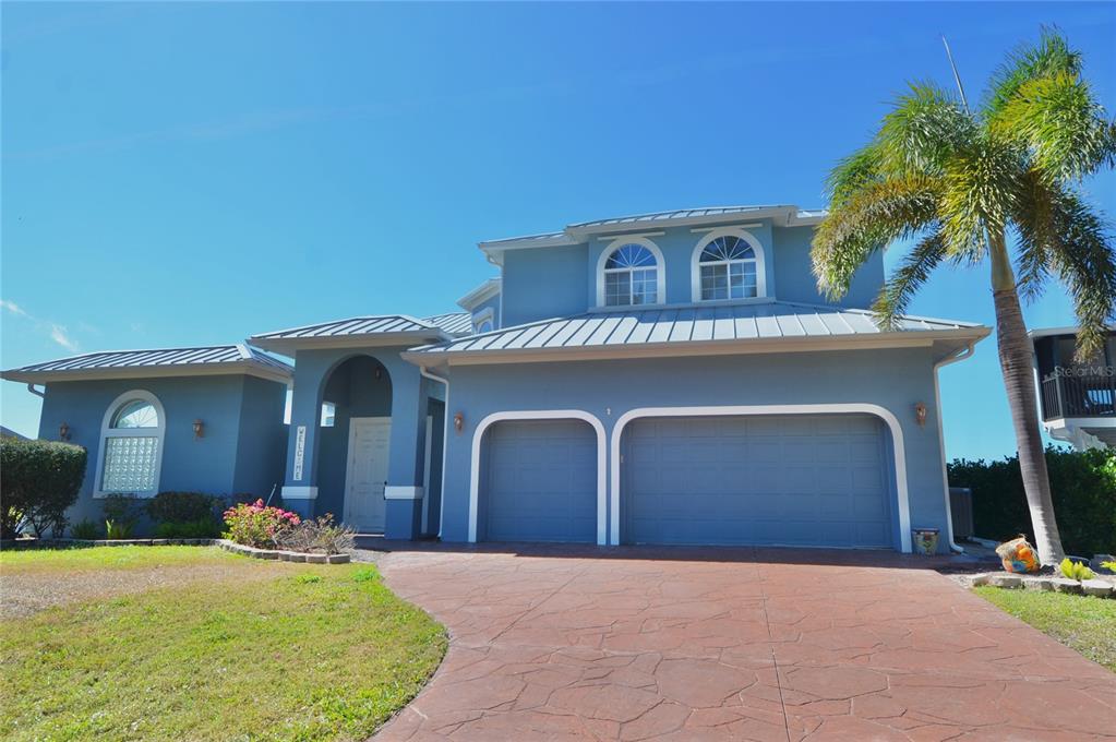 3605 Stabile Road St. James City, FL 33956 - Photo 88 of 95 a front view of a house with a yard