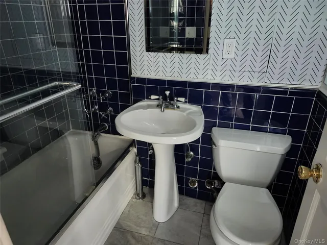 a view of livingroom with fireplace and bathroom