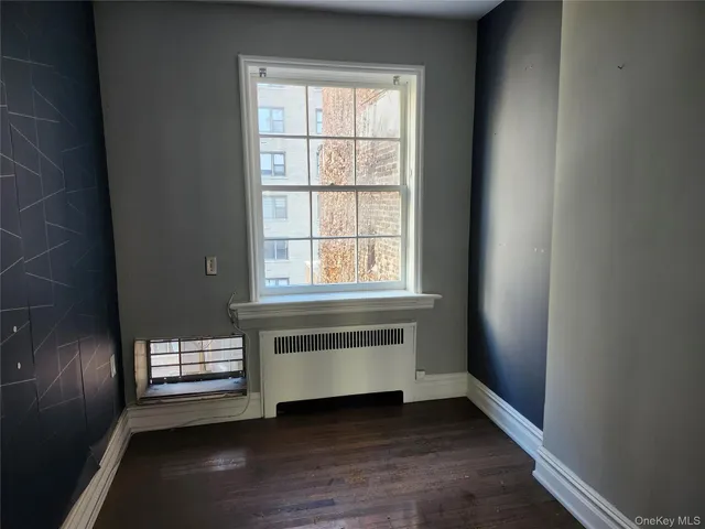 a kitchen with a sink a refrigerator a stove and white cabinets