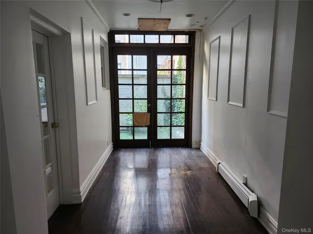 a view of entryway with wooden floor
