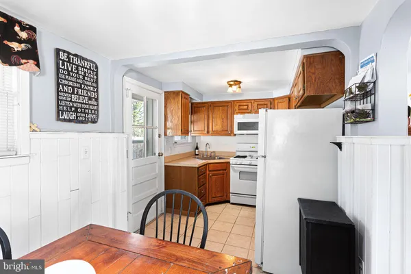 a kitchen with a refrigerator and a stove