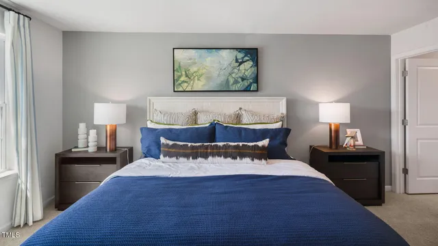 a bedroom with a bed and a lamp on table