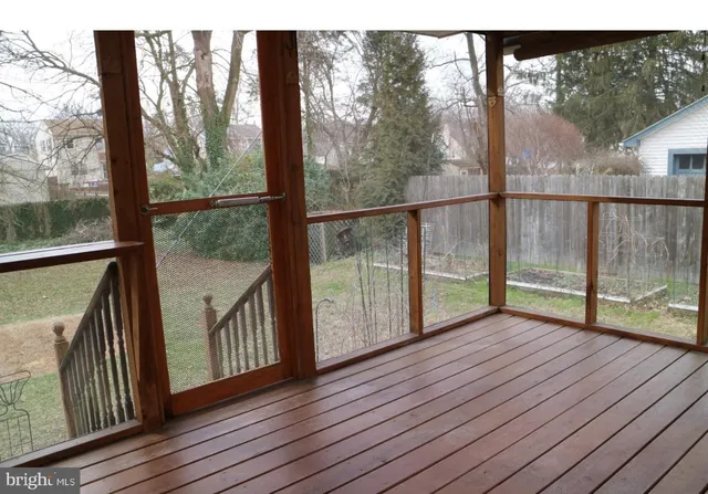 a view of hallway with wooden floor