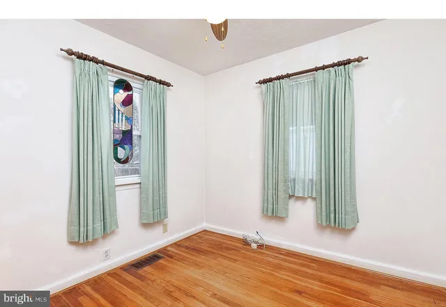 a view of an entryway with wooden floor