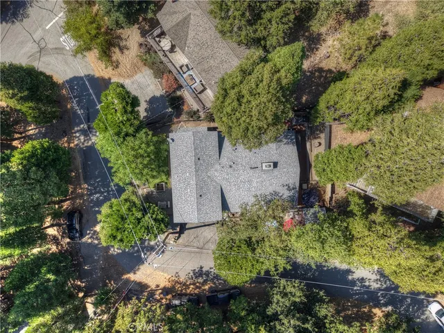 a view of a tables and chairs under an umbrella