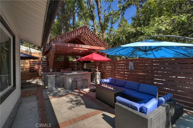 a outdoor space with patio couch and umbrella