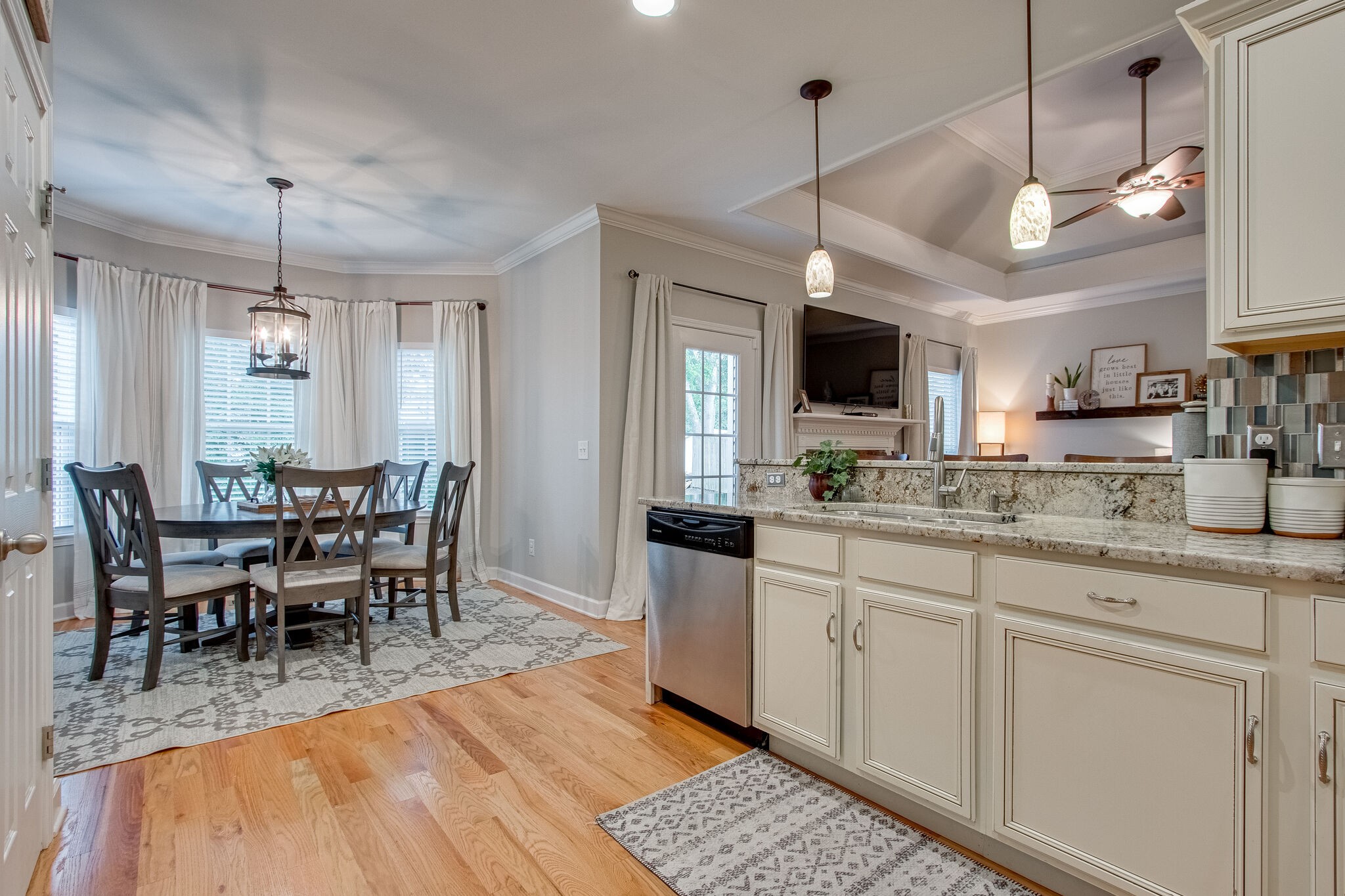 1094 Golf View Way Spring Hill, TN 37174 - Photo 13 of 26 a view of a dining room and livingroom with furniture wooden floor a chandelier