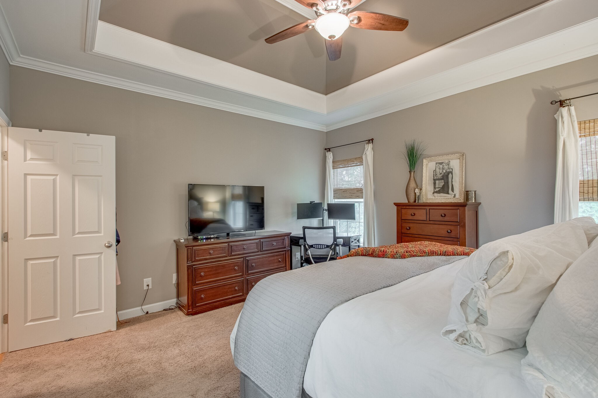 1094 Golf View Way Spring Hill, TN 37174 - Photo 16 of 26 a bedroom with a bed and a chandelier