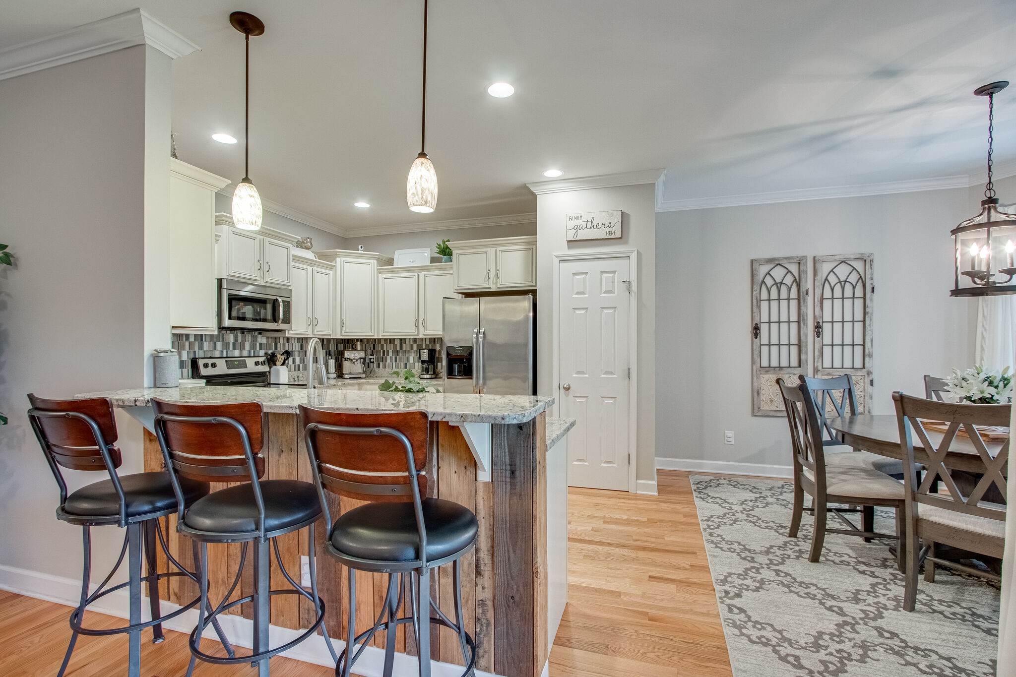 1094 Golf View Way Spring Hill, TN 37174 - Photo 8 of 26 a large kitchen with a table and chairs
