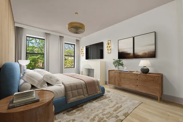 a bedroom with a large bed and a flat screen television