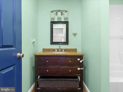 a bathroom with a toilet a sink and bathtub