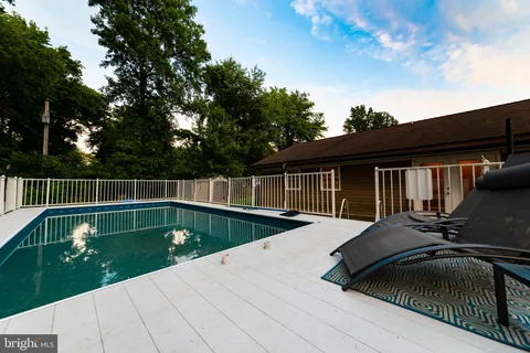 a view of balcony with wooden floor and fence