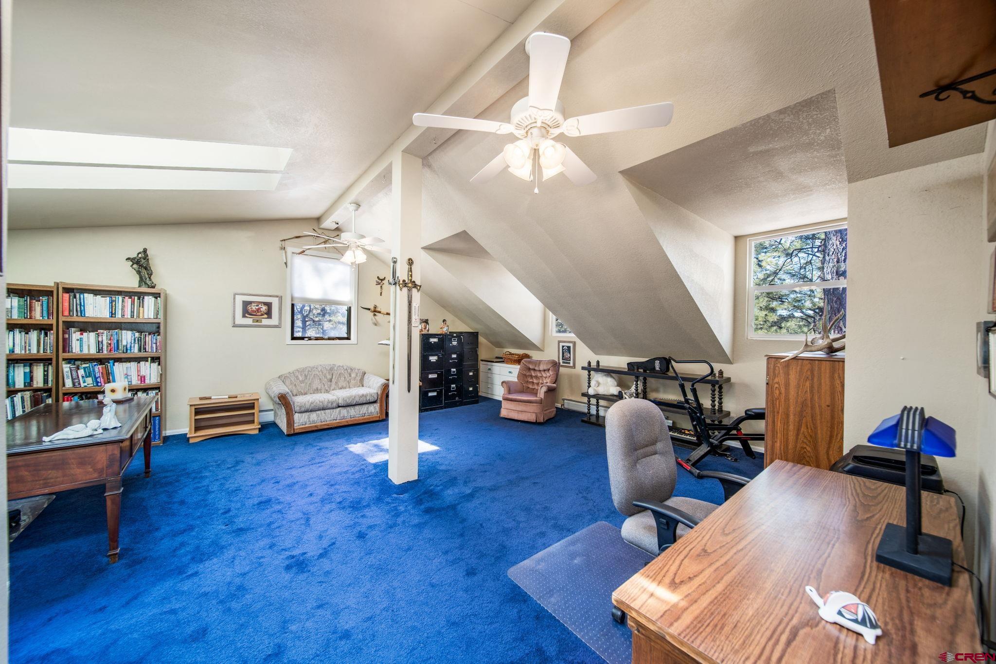 900 Spring Road Durango, CO 81303 - Photo 11 of 33 a living room with furniture and a wooden floor