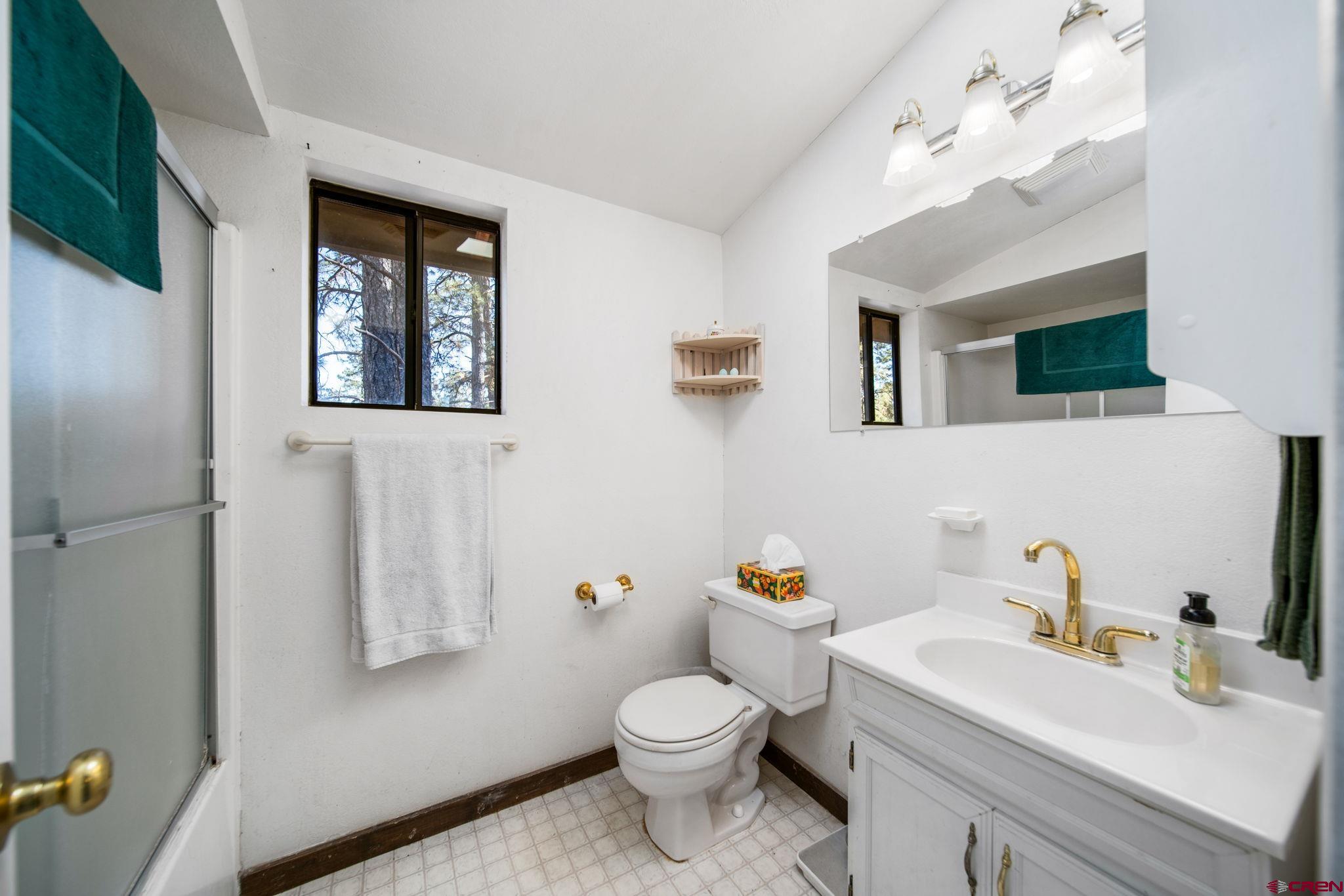 900 Spring Road Durango, CO 81303 - Photo 13 of 33 a bathroom with a sink toilet and shower