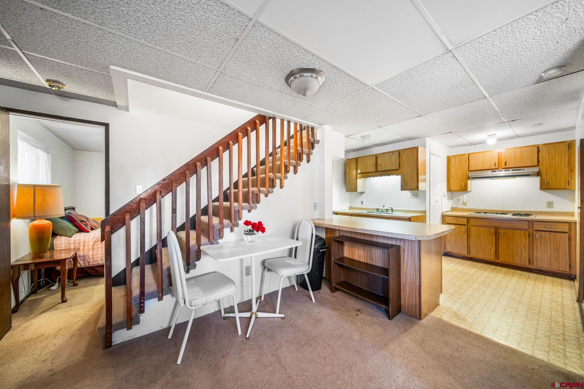 900 Spring Road Durango, CO 81303 - Photo 15 of 33 a living room with chairs and a stove