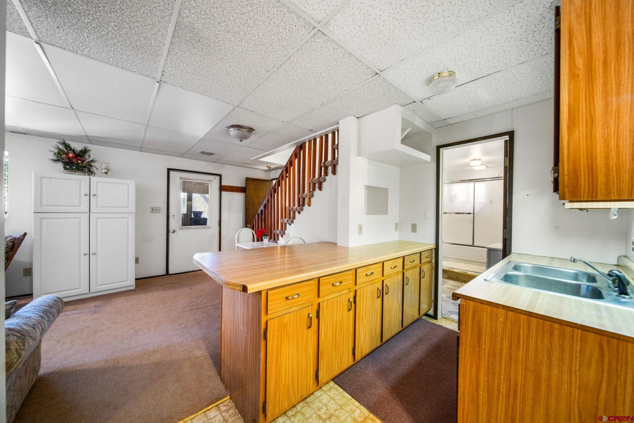 900 Spring Road Durango, CO 81303 - Photo 16 of 33 a spacious bathroom with a granite countertop sink and a mirror